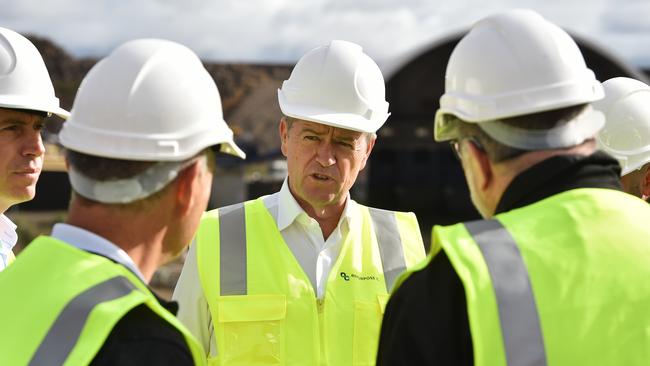 Federal Opposition Leader Bill Shorten (centre) during a tour of the "Repurpose It" recycling facility in Epping, Melbourne, Sunday, March 31, 2019. Shorten has announced labor's commitment to tackling plastic use and boosting recycling. (AAP Image/James Ross) NO ARCHIVING