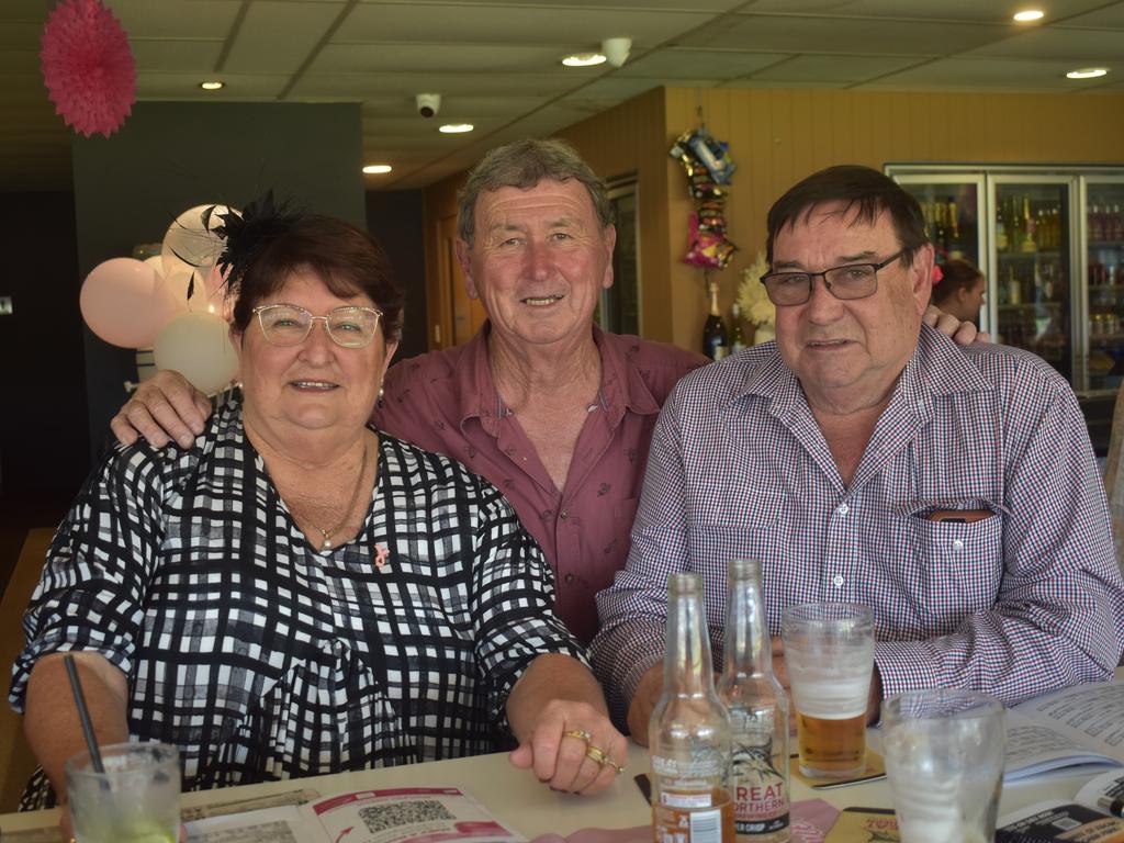 Trainer John O'Sing with Elaine Sturgiss and Greg Sturgiss at the Rockhampton Jockey Club's Pink Ribbon Stradbroke Charity Race Day at Callaghan Park on June 15, 2024.