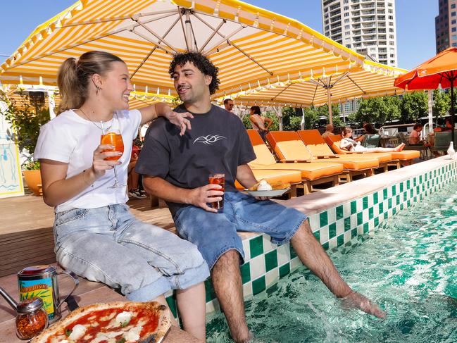 Scarlett Bibby and Daniel Hassoun enjoying the atmosphere at Arbory Afloat's Capri on the yarra river which is among the hot new bars to check out this summer. Picture: Ian Currie