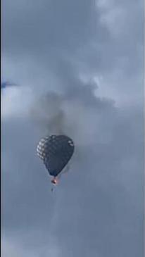 Harrowing video shows man dangling from hot air balloon before falling to his death