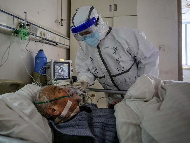 A man being tested for coronavirus in a Wuhan based hospital, called Red Cross Hospital. Picture: STR/AFP