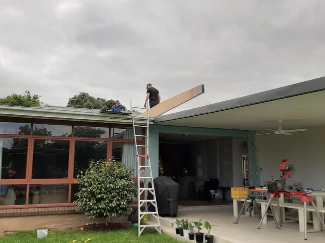 Matt Carman installing a lintel with his builder father