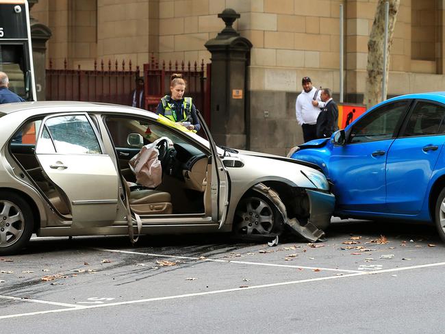 Police and emergency services attend a motor vehicle accident on Lonsdale Street, Melbourne. Picture: Mark Stewart