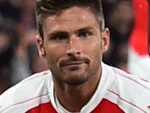 Arsenal's French striker Olivier Giroud (bottom) reacts after missing a shot on goal during the English Premier League football match between Arsenal and Liverpool at the Emirates stadium, north London on August 24, 2015. AFP PHOTO / BEN STANSALL RESTRICTED TO EDITORIAL USE. No use with unauthorized audio, video, data, fixture lists, club/league logos or 'live' services. Online in-match use limited to 75 images, no video emulation. No use in betting, games or single club/league/player publications.