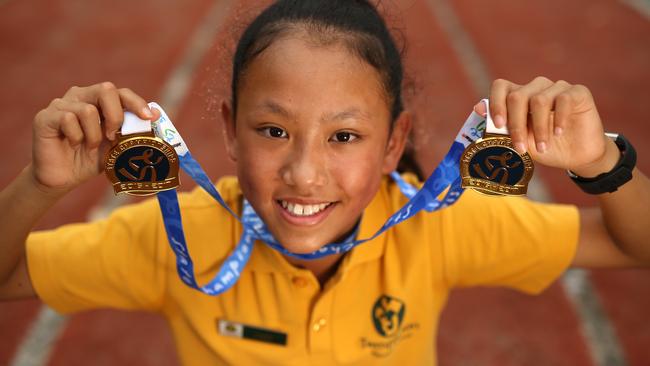 Jennifer with her medals. Picture: Stuart Milligan