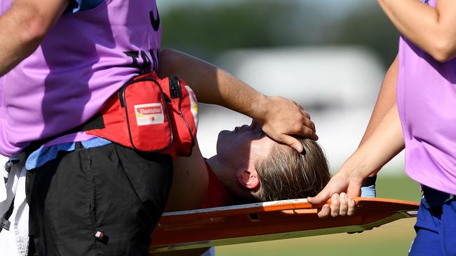 Huntington is carried from the field. Pic: Getty Images