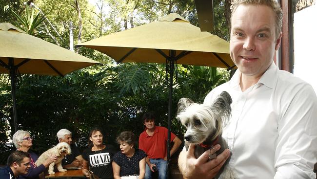 Greens MP Jamie Parker with Blanche the dog and other dog enthusiasts at the Erskineville Hotel. Picture: John Appleyard