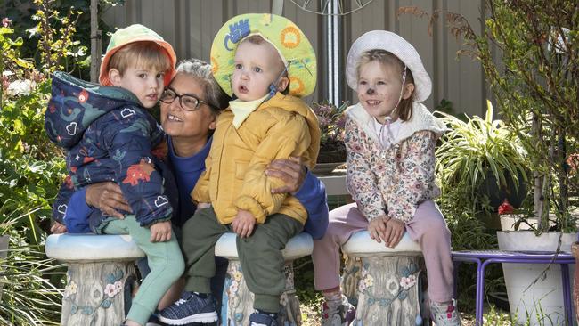 (From left) Elijah Usher, Georgette Ahfock, Scott Paterson and Darcy Stepanoff. Georgette Ahfock is recognised for her commitment to excellence in early childhood education and care. Picture: Nev Madsen.