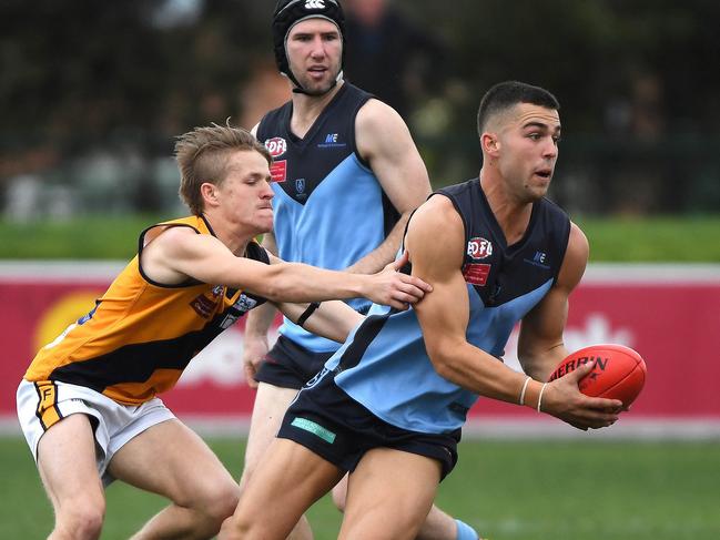 Stefan Rasinac (centre) of Aberfeldie in action during the EDFL footy preliminary final, at Windy Hill Oval, Essendon, Sunday, September 15, 2019. EDFL footy: Aberfeldie v Strathmore. (AAP Image/James Ross) NO ARCHIVING