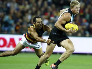 AFL - SHOWDOWN 42 - Port Adelaide v Adelaide Crows - Round 3 - Adelaide Oval. Eddie Betts tries to hold onto Tom Clurey. Picture Sarah Reed