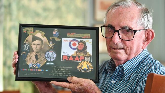 Veteran Terry Hayes holds a photograph of when he served in WWII. Picture: Tony Martin