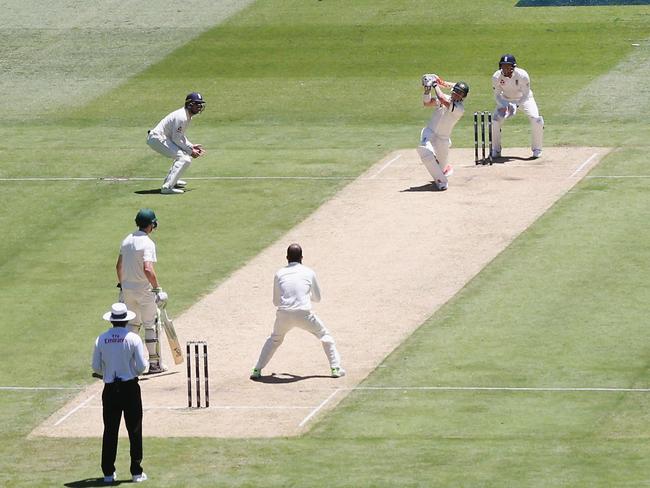 David Warner of Australia hits Moeen Ali of England for six