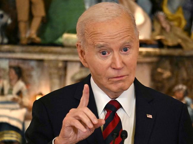 US President Joe Biden speaks at a Christmas for All Dinner in Celebration of Unity, America, and Special Olympics, in the East Room of the White House in Washington, DC, December 10, 2024. (Photo by Jim WATSON / AFP)