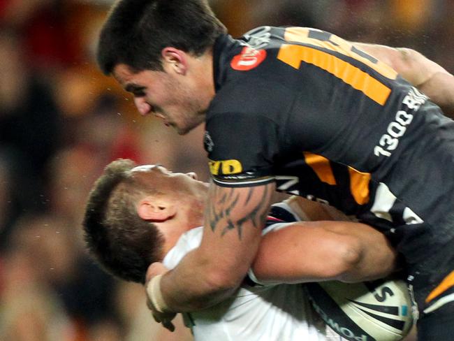 Simon Dwyer tackles Jared Waerea-Hargreaves during Wests Tigers v Sydney Roosters NRL qualifying final at the SFS in Sydney.