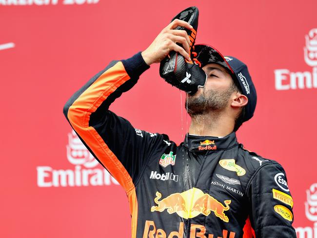 SPIELBERG, AUSTRIA - JULY 09:  Daniel Ricciardo of Australia and Red Bull Racing celebrates finishing in third place on the podium during the Formula One Grand Prix of Austria at Red Bull Ring on July 9, 2017 in Spielberg, Austria.  (Photo by Mark Thompson/Getty Images)