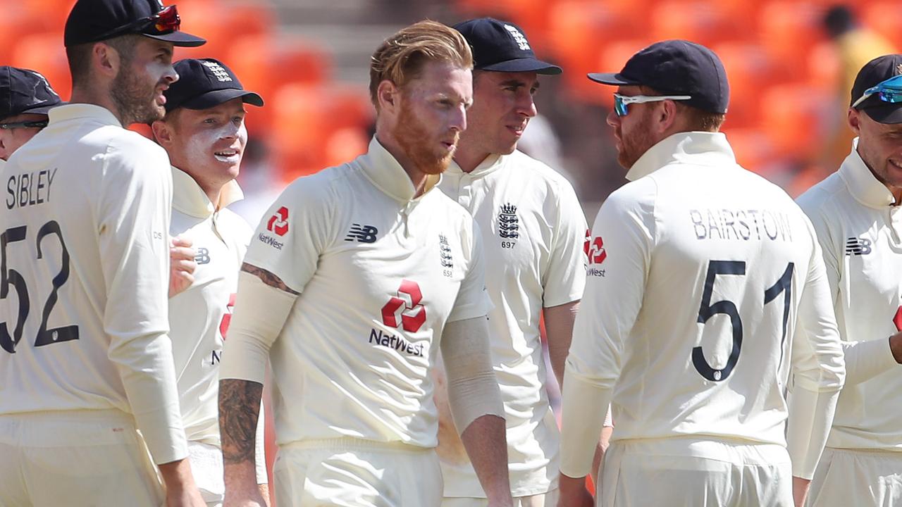 Ben Stokes celebrates with (L-R) Dom Sibley, Ollie Pope, Dan Lawrence, Jonny Bairstow and Joe Root after taking the wicket of Virat Kohli of India.