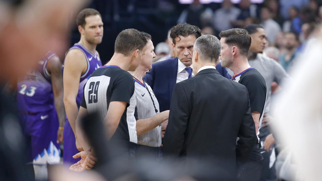 Utah Jazz coach Quin Snyder meets with Oklahoma City coach Billy Donovan and officials before before an NBA basketball game was postponed in Oklahoma City.