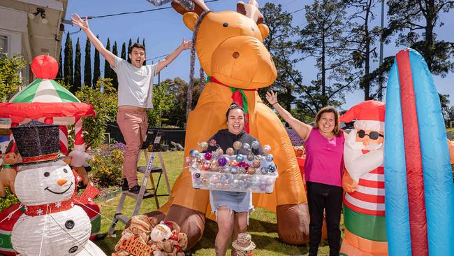 Chandlar Sutterby, 23, Edna Mahina, 19 and Tanya Sutterby are planning another summer-themed lights display as part of this year’s Christmas lights on The Boulevard in Ivanhoe. File Picture: Jason Edwards