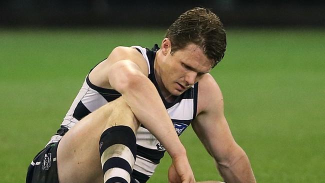 Patrick Dangerfield slumps to the turf after the siren on Friday night. Picture: Wayne Ludbey