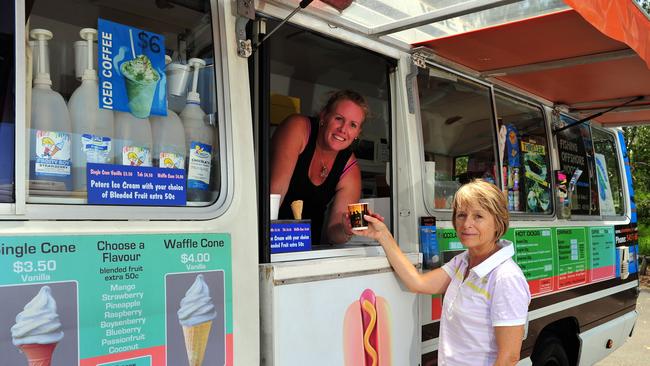 Amanda Simpson (left) serves owner Caroline Draper at Spit Beach Snacks,