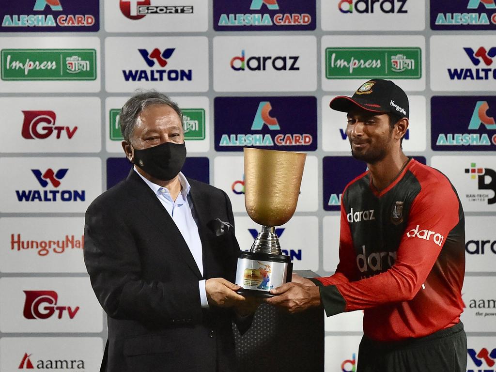Bangladesh's captain Mahmudullah receives the tournament trophy.