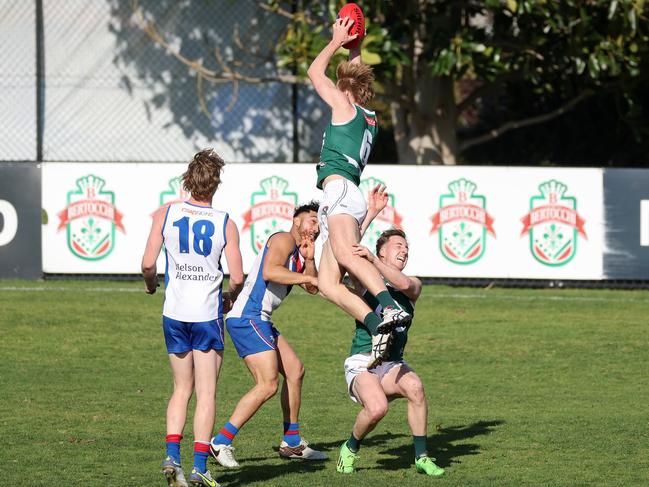 NFL: Greensborough’s Angus Seivers takes a towering mark. Picture: George Sal