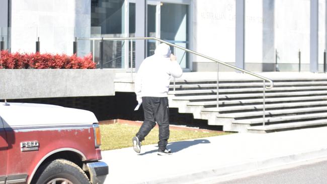 David Brooke donned his hood as he left the ACT Magistrates Court on July 6, 2023. Picture: Sam Turner