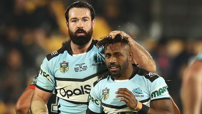 Aaron Woods celebrates with James Segeyaro after winning his first match as a Shark. Picture: Getty