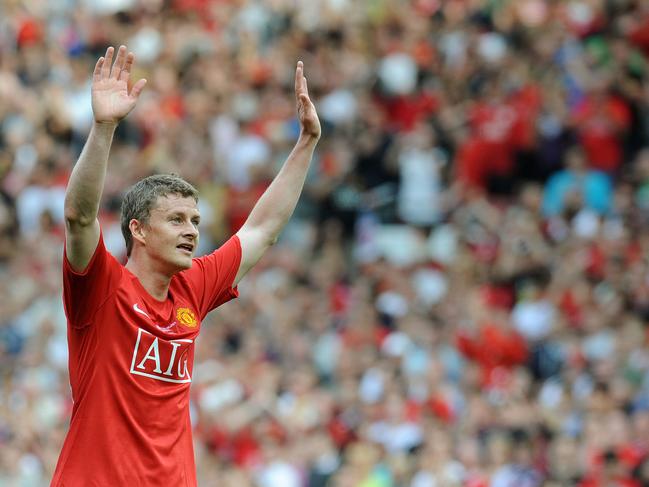 (FILES) In this file photo taken on August 02, 2008 Ole Gunnar Solskjaer of Manchester United waves to the fans at the final whistle after his testimonial football match between Manchester United and Espanyol at Old Trafford, in Manchester, north-west England. - Ole Gunnar Solskjaer was on December 19, 2018, named as Manchester United's caretaker manager until the end of the 2018/19 season following the sacking of Jose Mourinho. The former United striker will take charge of the first team with immediate effect and will remain in place while the club looks for a new full-time manager. (Photo by Andrew YATES / AFP) / RESTRICTED TO EDITORIAL USE. No use with unauthorized audio, video, data, fixture lists, club/league logos or 'live' services. Online in-match use limited to 75 images, no video emulation. No use in betting, games or single club/league/player publications. /