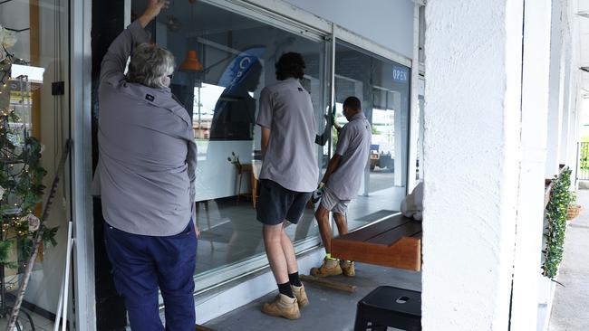 Fish and chip shop Balaclava Fish on Balaclava Road was broken into on Tuesday night, with the front glass door shattered. Glaziers work on replacing the front glass door to make the small business secure again. Picture: Brendan Radke