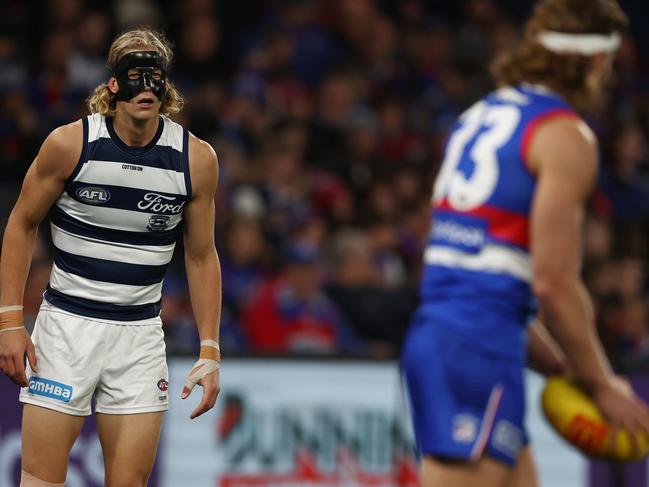The Cat in the mask had a good duel with headbanded Aaron Naughton. Picture: Michael Klein.