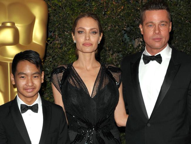 Maddox Jolie-Pitt, from left, Angelina Jolie and Brad Pitt in 2013. Picture: AP