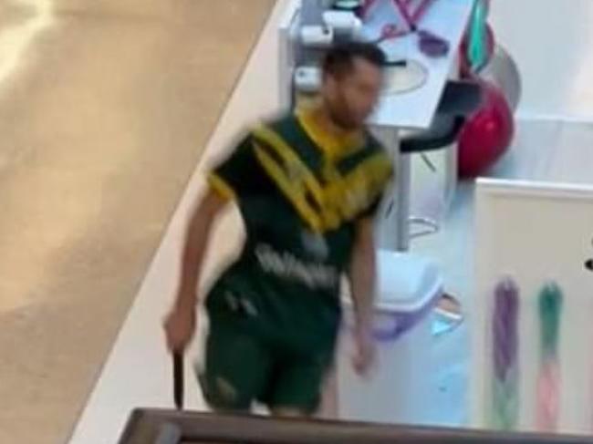 Photo shows the knifeman running through Bondi Junction Westfield. Twitter