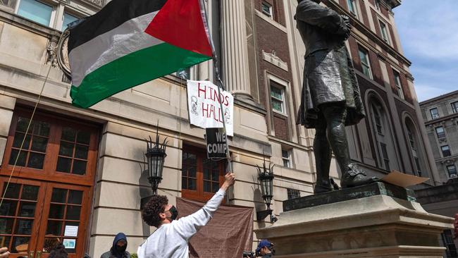 Student protesters wave a Palestinian flag on the front steps of Hamilton Hall at Columbia University on Tuesday. Picture: AFP