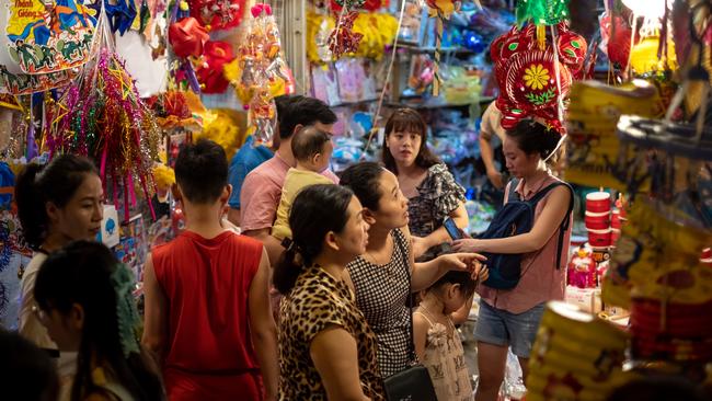 People in Vietnam shop for Mid-Autumn Moon Festival goods on Hang Ma Street in which houses and sidewalks have turned into makeshift shops. Celebrations will be significantly less croded in Australia thanks to COVID-19 restrictions. Picture: Linh Pham/Getty)