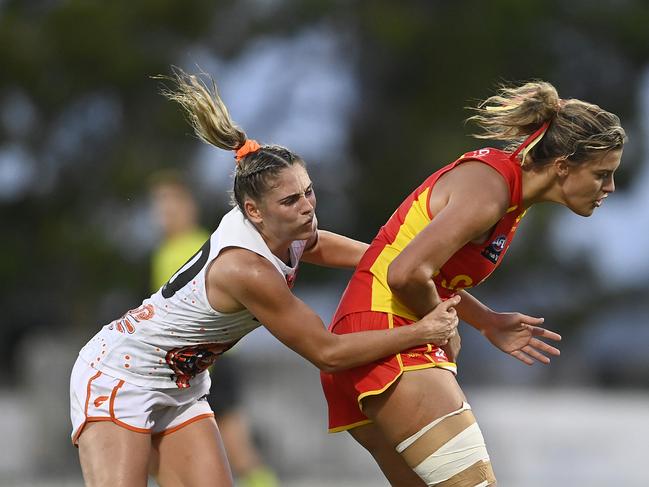 Lauren Bella of the Suns is tackled by Lisa Steane of the Giants during the round one AFLW match between the Gold Coast Suns and the Greater Western Sydney Giants at the Great Barrier Reef Arena on January 09, 2022 in Mackay, Australia. Picture: Ian Hitchcock