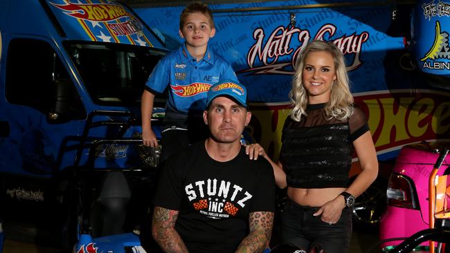 Matt Mingay with his family and stunt vehicles. Picture: Scott Fletcher