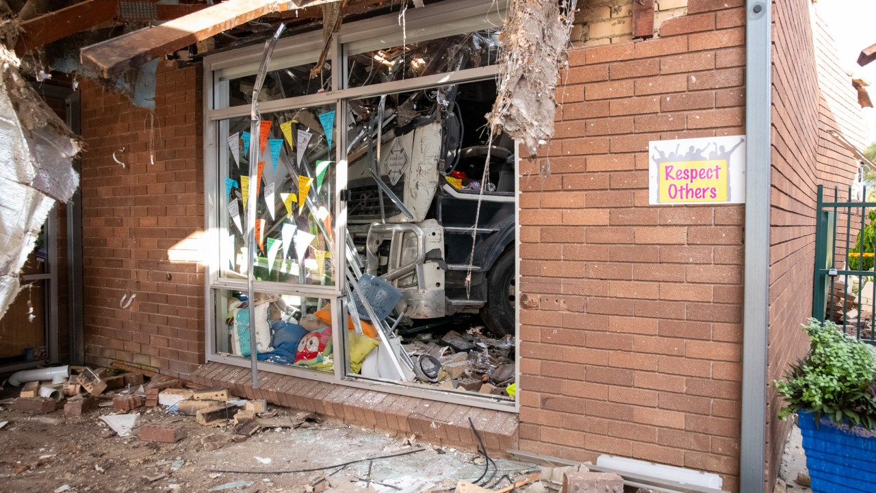 Truck ploughs into Sydney school classroom after collision with 19 cars