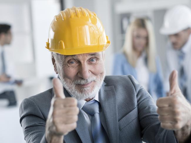 Senior business man looking at the camera, showing thumbs up. senior workers generic, older employees