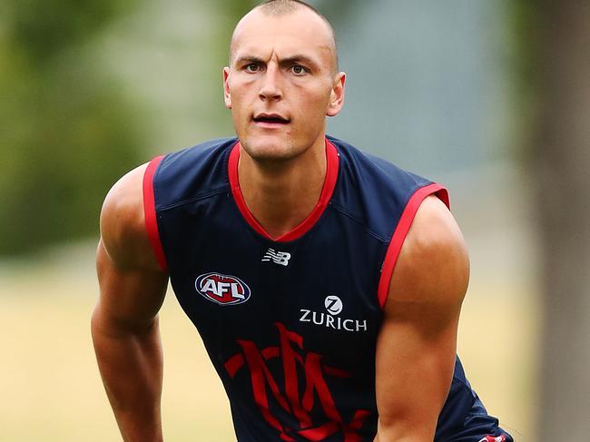 MELBOURNE, AUSTRALIA - FEBRUARY 18: Braydon Preuss handballs during a Melbourne Demons AFL training session at Gosch's Paddock on February 18, 2019 in Melbourne, Australia. (Photo by Michael Dodge/Getty Images)