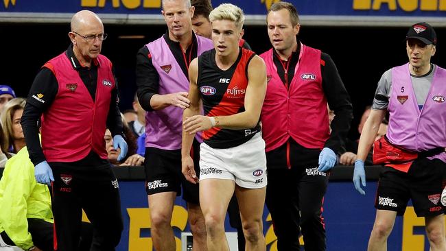 Guelfi needed treatment from Essendon’s medical staff before heading to hospital. Picture: Getty