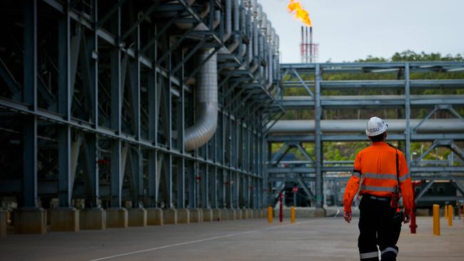 A worker walks through the Shell’s Queensland Curtis Liquefied Natural Gas project site. Picture: Bloomberg