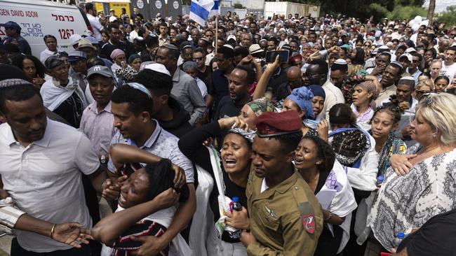 Family and friends mourn during a funeral on Sunday for Sergeant Yosef Dassa, killed in northern Gaza Strip last week. Picture: Getty Images