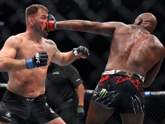 Jon Jones plants a face palm on Stipe Miocic. Picture: Sarah Stier/Getty Images