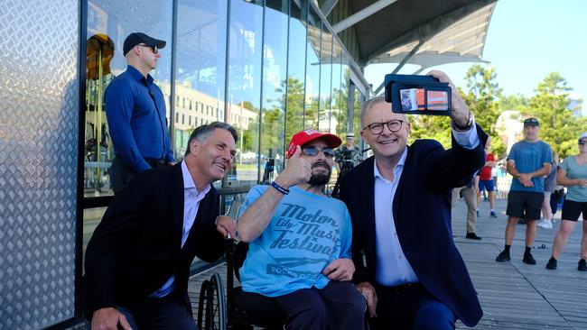 PM Anthony Albanese and Deputy PM Richard Marles pose for a selfie after giving a press conference in Geelong. Mr Albanese then took a private helicopter trip to a barbecue at Lindsay Fox’s seaside mansion. Picture: NCA NewsWire/Luis Enrique Ascui