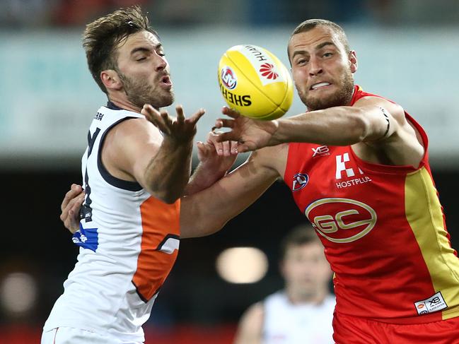 Shane Mumford of the Giants and Jarrod Witts of the Suns compete for the ball during the round 23 AFL match between the Gold Coast Suns and the Greater Western Sydney Giants at Metricon Stadium on August 24, 2019 in Gold Coast, Australia. (Photo by Jono Searle/AFL Photos/via Getty Images)