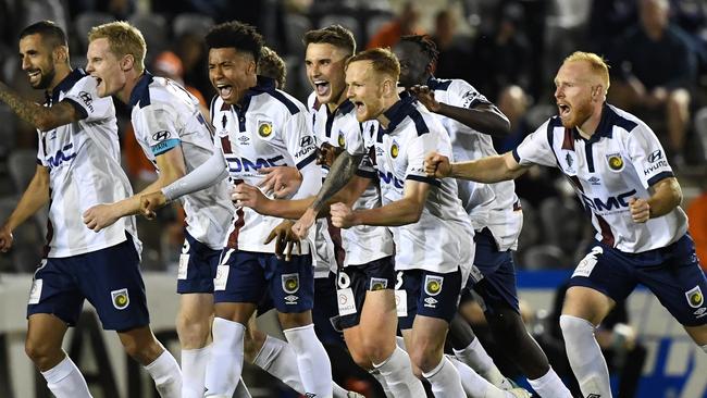 Mariners players celebrate their penalty shootout win. Picture: AAP