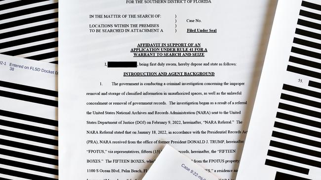 Pages from the F.B.I. search warrant affidavit for former President Donald Trump's Mar-a-Lago estate. (Photo Illustration by Mario Tama/Getty Images)