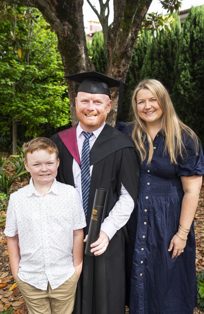 Bachelor of Engineering (Honours) graduate Adam Smith with son Aiden and wife Felicity Smith at a UniSQ graduation ceremony at The Empire, Wednesday, October 30, 2024. Picture: Kevin Farmer