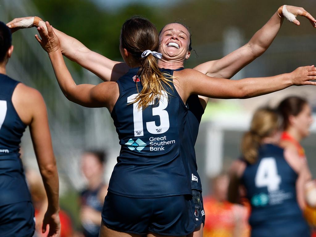 Lulu Beatty and Harriet Cordner celebrate after Carlton’s matchwinning goal on Sunday, which was decided with ball-tracking technology. Picture: Michael Willson/AFL Photos via Getty Images.